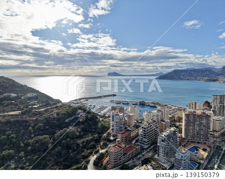 Aerial drone footage of coastal urban landscape during sunrise highlighting sparkling waters Aerial drone footage of coastal urban landscape during sunrise highlighting sparkling waters 139150379