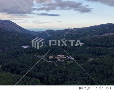 Serene landscape vista, Tranquil aerial perspective showcasing lush valleys and rolling hills Serene landscape vista, Tranquil aerial perspective showcasing lush valleys and rolling hills 139150404