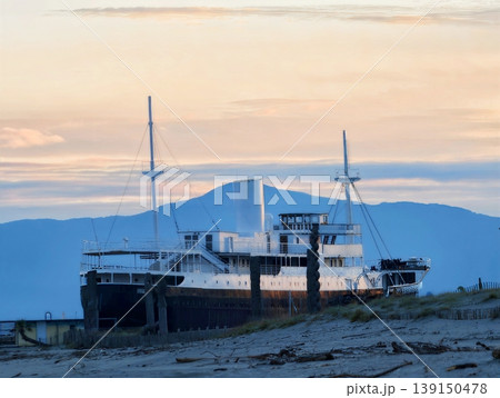 Vintage boat scene. Recall of tranquil maritime scene featuring vintage cruise ship and soft sunset 139150478