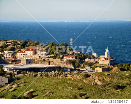 Bright lighthouse guides. Shining beacon provides secure navigation for ships entering and leaving port Bright lighthouse guides. Shining beacon provides secure navigation for ships entering and leaving port 139150487