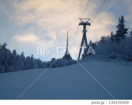 Dawn casts peaceful snowy scenes. Serene morning at mountain peak with untouched snow and tranquil air 139150569