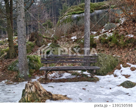 Travel through snowcovered woods and hills. Exploring wintry landscapes along winding icy forest routes 139150598