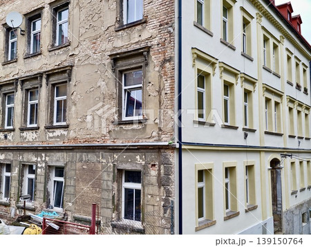 Construction site overview. Renovation zone with tools. Urban development area with scaffolding and debris Construction site overview. Renovation zone with tools. Urban development area with scaffolding and debris 139150764