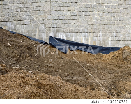 Site work details. Work site showing backfilled slope and drainage setup preparations ongoing Site work details. Work site showing backfilled slope and drainage setup preparations ongoing 139150781