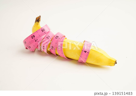 Banana with measuring tape, penis health. Banana with measuring tape, penis health. 139151483