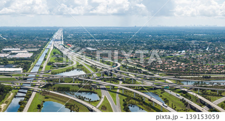 Wide multilane highway crossroads in Miami, Florida with fast driving cars. Above view of USA transportation infrastructure 139153059