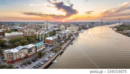 Waterfront River Street in Savannah, Georgia. Historic American architecture of old historical city. USA Southern cityscape at sunset Waterfront River Street in Savannah, Georgia. Historic American architecture of old historical city. USA Southern cityscape at sunset 139153073