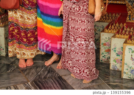 Three women visiting a temple in Bangkok Three women visiting a temple in Bangkok 139155396