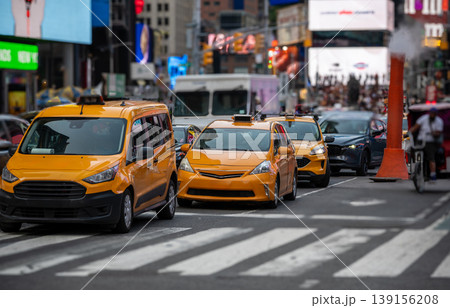 New york, usa august 16,2024. Yellow taxis navigating heavy traffic in new york city's times square, showcasing urban life and bustling street activity New york, usa august 16,2024. Yellow taxis navigating heavy traffic in new york city's times square, showcasing urban life and bustling street activity 139156208