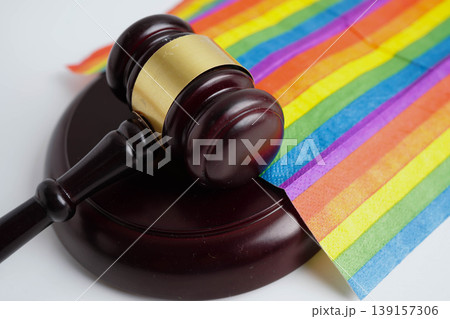 Gavel for judge lawyer on rainbow flag, symbol of LGBT pride month. 139157306