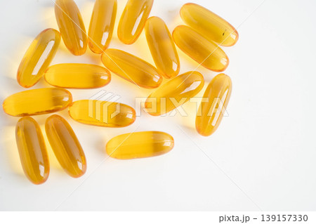 Fish oil or Cod liver oil gel in capsules with omega 3 vitamins, supplementary healthy food. Fish oil or Cod liver oil gel in capsules with omega 3 vitamins, supplementary healthy food. 139157330