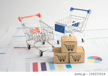 Online shopping, Shopping cart box on business graph, import export, finance commerce. Online shopping, Shopping cart box on business graph, import export, finance commerce. 139157418