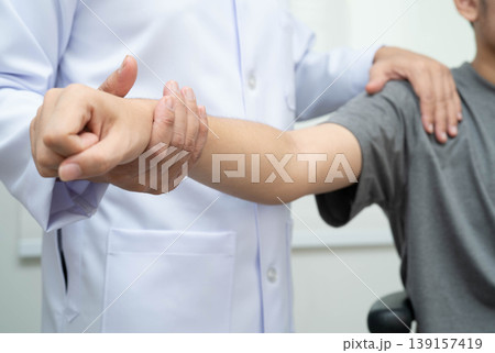 Physical therapy, Asian therapist doctor treat perform pain young man in hospital. 139157419
