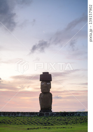 Calm moai statue resting on easter island chile during colorful sunset Calm moai statue resting on easter island chile during colorful sunset 139157902