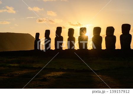 Majestic and peaceful moai statue silhouette at sunset on easter island chile Majestic and peaceful moai statue silhouette at sunset on easter island chile 139157912