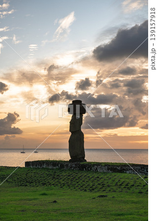 Majestic moai statue on easter island chile standing peaceful against dramatic sunset sky Majestic moai statue on easter island chile standing peaceful against dramatic sunset sky 139157918