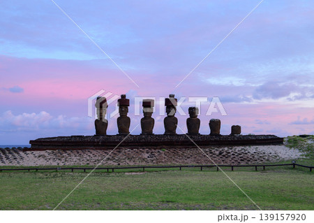 Majestic easter island chile moai statue standing in peaceful pink twilight sky 139157920