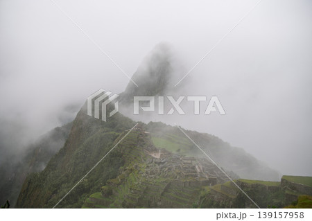 Mysterious thick fog hides ancient mountain ruin of machu picchu Mysterious thick fog hides ancient mountain ruin of machu picchu 139157958