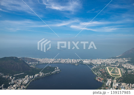 Majestic aerial view overlooking beautiful coastal city landscape of rio de janeiro with peaceful blue lagoon and ocean 139157985