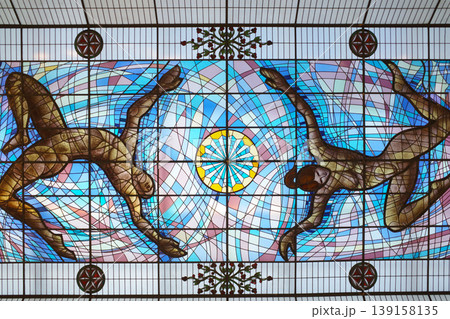 Stained glass ceiling of a building Stained glass ceiling of a building 139158135
