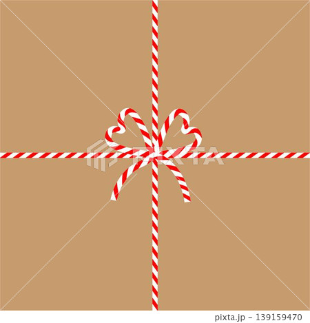 Square craft brown background with candy cane ribbon. Christmas packing string for decoration and present 139159470