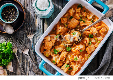 Indian fish curry with cauliflower and green peas Indian fish curry with cauliflower and green peas 139159766
