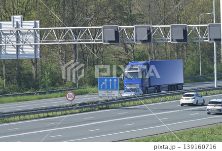 Blue Truck On Highway Near Speed Limit Sign 139160716
