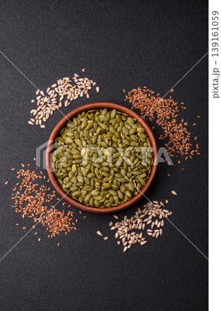 Shelled pumpkin seed kernels, salted, roasted, or raw, are a healthy ingredient. Pumpkin seeds 139161059