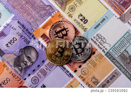 A conceptual financial background, Bitcoin against the Rupee. Bitcoin on the Indian currency A conceptual financial background, Bitcoin against the Rupee. Bitcoin on the Indian currency 139161082