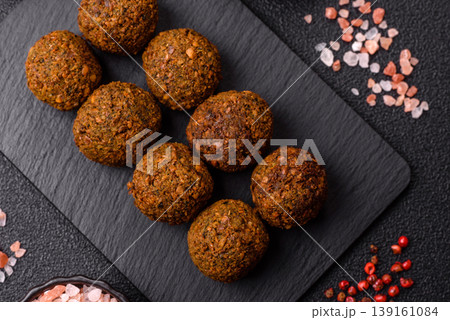 Falafel, a hearty Arabic dish made from boiled chickpeas for vegetarians. Chickpea falafel Falafel, a hearty Arabic dish made from boiled chickpeas for vegetarians. Chickpea falafel 139161084