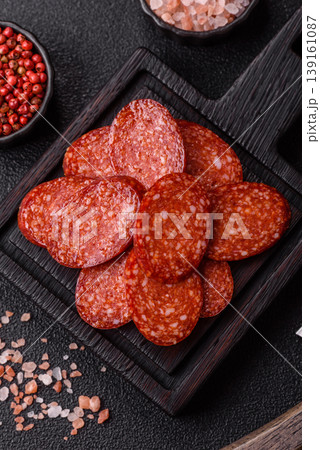 Sliced smoked pepperoni or salami as a pizza topping. Pepperoni sausage Sliced smoked pepperoni or salami as a pizza topping. Pepperoni sausage 139161087