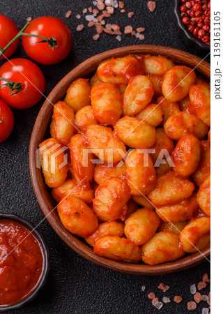 Homemade potato gnocchi with Bolognese sauce, seasoned with salt and spices. Gnocchi with sauce Homemade potato gnocchi with Bolognese sauce, seasoned with salt and spices. Gnocchi with sauce 139161105