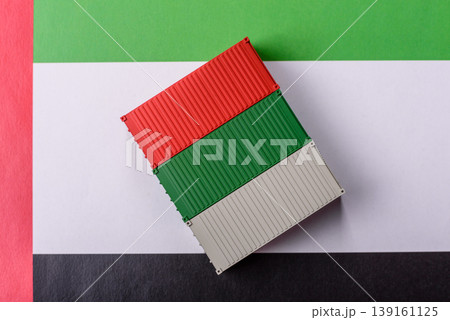 Cargo containers on the UAE flag as a conceptual backdrop for goods export. Cargo containers Cargo containers on the UAE flag as a conceptual backdrop for goods export. Cargo containers 139161125