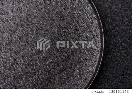 An empty ceramic round plate, kitchen utensils for a dinner table. An empty plate 139161148