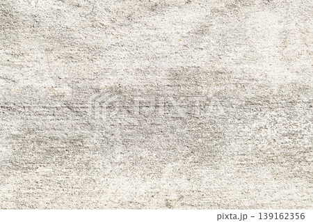 Close-up of Light-colored textured concrete wall with rough surface and subtle color variations 139162356