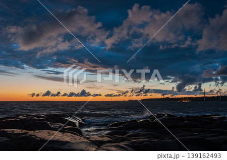 Sunset colours, clouds and rocks on the shore of the Baltic sea, Pori, Finland Sunset colours, clouds and rocks on the shore of the Baltic sea, Pori, Finland 139162493