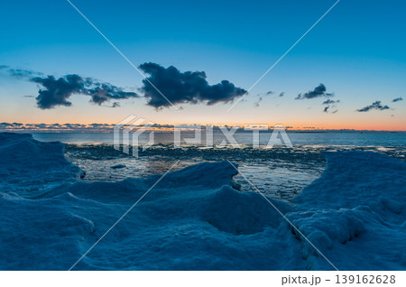 The frozen shores of Gulf of Bothnia in winter in Finland with packed ice in the foreground The frozen shores of Gulf of Bothnia in winter in Finland with packed ice in the foreground 139162628