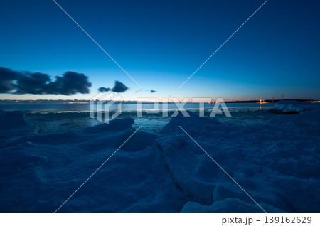 The frozen shores of Gulf of Bothnia in winter in Finland with packed ice in the foreground The frozen shores of Gulf of Bothnia in winter in Finland with packed ice in the foreground 139162629