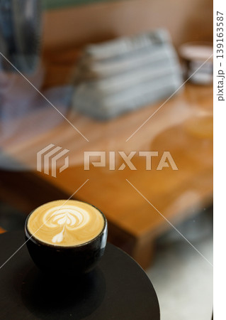 Cup of hot milk latte coffee on table. 139163587