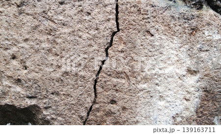 Cracked and Dull Concrete Wall Texture with Rough Details 139163711