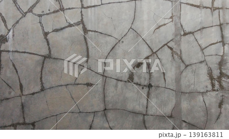 Cracked Concrete Wall Texture with Abstract Pattern Cracked Concrete Wall Texture with Abstract Pattern 139163811