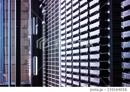 cluster of hard drives stacked inside data storage cabinet cluster of hard drives stacked inside data storage cabinet 139164038