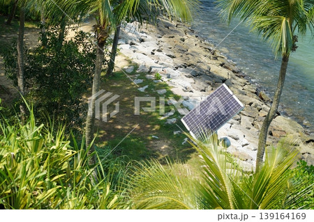Coastal Scenery with Solar Panel and Palm Trees Coastal Scenery with Solar Panel and Palm Trees 139164169