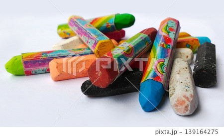 Stack of Colorful Crayons with Cute Designs on White Background Stack of Colorful Crayons with Cute Designs on White Background 139164275