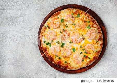 four cheese pizza with shrimp and fresh microgreens, served on a wooden board, homemade, no people, four cheese pizza with shrimp and fresh microgreens, served on a wooden board, homemade, no people, 139165640