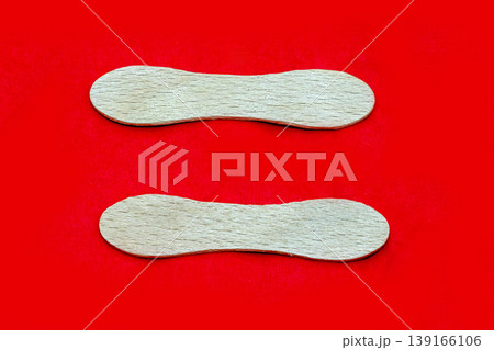 Wooden sticks on red napkin Wooden sticks on red napkin 139166106