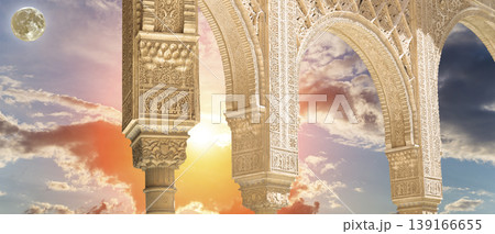 Arches in Islamic (Moorish) style (against the sunset with the super moon) in Alhambra, Granada, Spain Arches in Islamic (Moorish) style (against the sunset with the super moon) in Alhambra, Granada, Spain 139166655