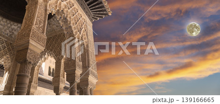 Arches in Islamic (Moorish) style (against the sunset with the super moon) in Alhambra, Granada, Spain 139166665
