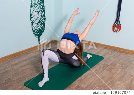 Fit woman practicing yoga crescent lunge backbend Fit woman practicing yoga crescent lunge backbend 139167074