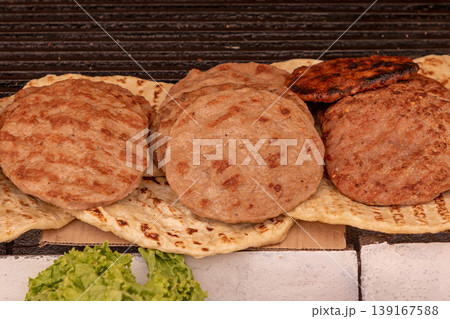 Grilled hamburbers on a market Grilled hamburbers on a market 139167588